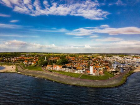 Aerial view of Urk with its lighthouse a small town on the IJsselmeerの写真素材
