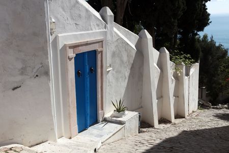 Sidi Bou Said - typical building with white walls, blue doors and windowsの写真素材