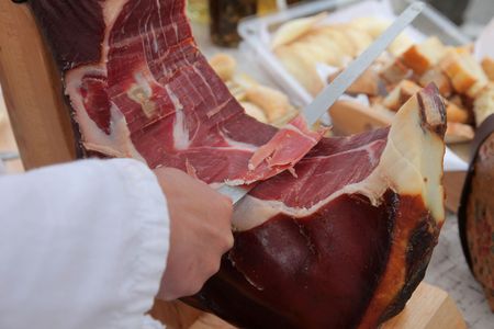 A hand cutting prosciuttoの写真素材