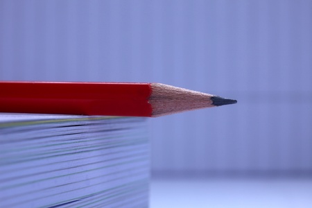 Pencil on white book の写真素材