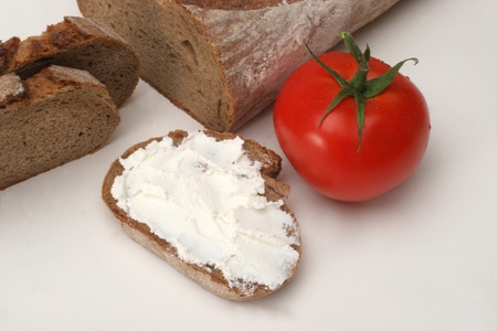 Bread with cream cheese and tomatoの写真素材