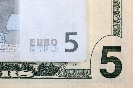 5 euros and 5 dollarsの写真素材