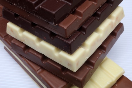 Close up of chocolate pieces on white background の写真素材