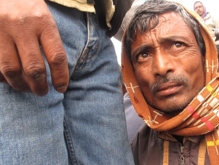 KOLKATA - JANUARY 15: Portrait of a day labourer January 15, 2009 in Kolkata, India. These men sit...