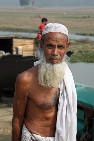 BASANTI - JANUARY 14: Portrait of a day laborer January 14, 2009 in Basanti, West Bengal, India. These men sit on the street hoping to get day jobs not paid more than 2,5 dollars a day.のeditorial素材