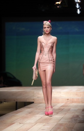 ZAGREB, CROATIA - MARCH 23: Fashion model wears clothes made by ELFS on "CRO A PORTER" show on March 23, 2012 in Zagreb, Croatia.のeditorial素材