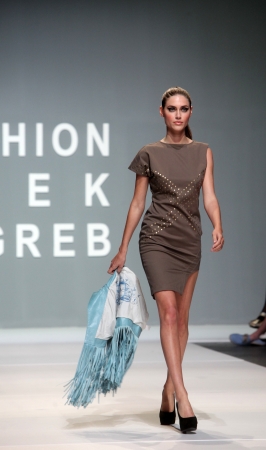 ZAGREB, CROATIA - May 10: Fashion model wears clothes made by Kristina Burja on "ZAGREB FASHION WEEK" show on May 10, 2012 in Zagreb, Croatia.のeditorial素材