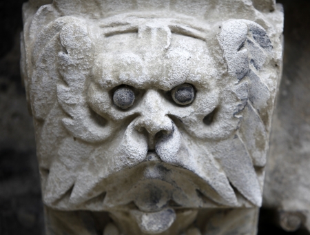 Sculpted stone mask figure on St. Stephens Cathedral in Viennaの写真素材