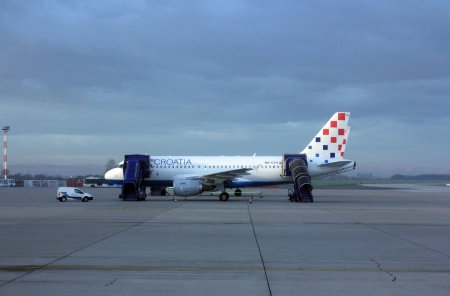 ZAGREB, CROATIA - NOVEMBER 04: Croatia Aerlines A319 serviced by the ground crew on November 04, 2012 in Zagreb, Croatia. Croatia Airlines is a Star Alliance member and the leading airline (in terms of passengers) from the former Yugoslavia.のeditorial素材