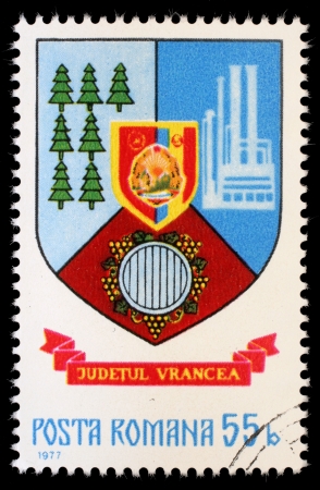 ROMANIA - CIRCA 1977: A stamp printed in Romania, shows coat of arms of Vrancea County , circa 1977のeditorial素材