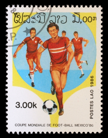 LAOS - CIRCA 1986: A Stamp printed in LAOS shows the Soccer Players, with the inscription and name of series \"World Cup Football Championship, Mexico - 1986\", circa 1986のeditorial素材