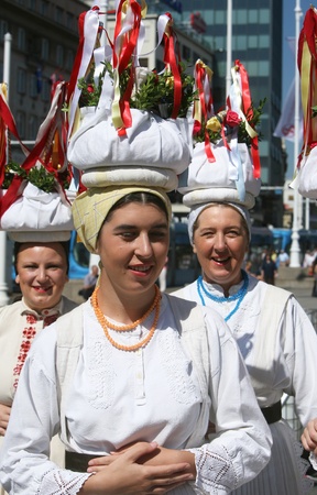 ZAGREB,CROATIA - JULY 17  Members of folk groups Sloga from Veliko Trgovisce in Croatia national costume during the 47th International Folklore Festival in center of Zagreb,Croatia on July 17,2013のeditorial素材