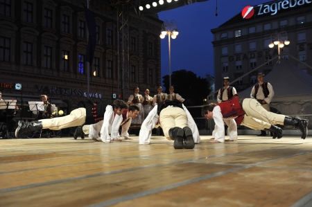 ZAGREB,CROATIA - JULY 18  Members of the ensemble song and dance Warsaw School of Economics in Polish national costume during the 47th International Folklore Festival in center of Zagreb,Croatia on July 18,2013のeditorial素材