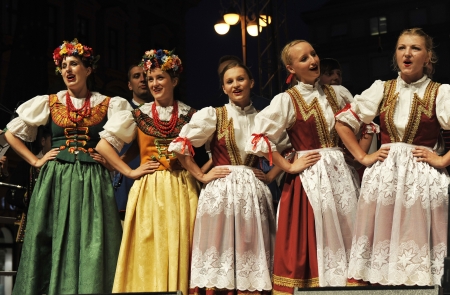 ZAGREB,CROATIA - JULY 18: Members of the ensemble song and dance Warsaw School of Economics in Polish national costume during the 47th International Folklore Festival in center of Zagreb,Croatia on July 18,2013のeditorial素材