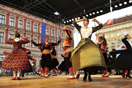 ZAGREB,CROATIA - JULY 19: Members of folk groups Marko Marojica from Zupa Dubrovacka in Croatia national costume during the 47th International Folklore Festival in center of Zagreb,Croatia on July 19,2013のeditorial素材