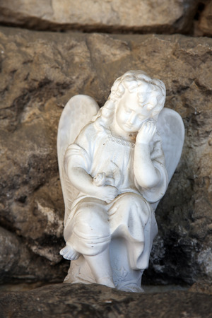 A white mourning porcelain angel at Mirogoj cemetery, Zagreb, Croatiaの写真素材