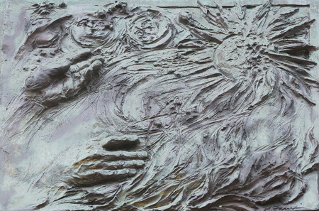God Creating the Earth, detail on the door of the church of St  James the Greater in Porto Azzurro, Elba, Italyの写真素材