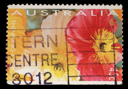 Stamp printed in Australia shows red and yellow flowers, circa 1994の写真素材