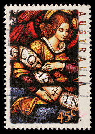 Stamp printed in Australia shows Angel with Gloria in excelsis Deo Banner, circa 1995のeditorial素材