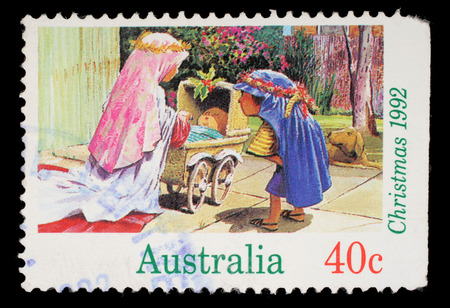 Stamp printed in Australia shows children playing to the Holy Family, circa 1992のeditorial素材