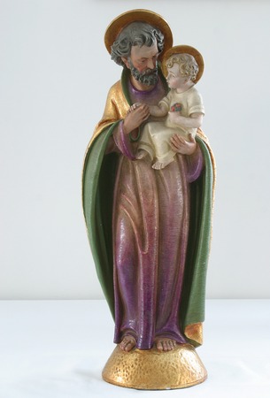 Saint Joseph holding baby Jesus
