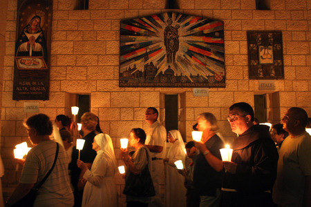 People in Friday procession goes through the streets of Nazareth, from the Church of St  Joseph to the Basilica of the Annunciation, Nazareth, Israel on September 30, 2006 のeditorial素材