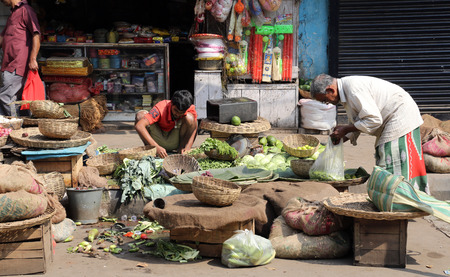 Street trader sell vegetables outdoor on February 12, 2014 in Kolkata India. Only 0.81% of the Kolkataのeditorial素材