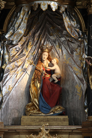 Madonna with child Jesus, altar in the Neumunster Collegiate Church in Wurzburg on July 18, 2013.のeditorial素材