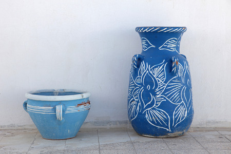 Jugs in front of a white wallの写真素材