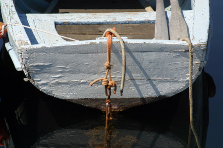 A wooden rowing boat tide down