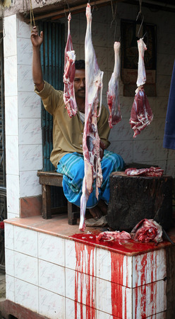 Butcher and his stall at the market in India where hygiene is very poor, Baruipur, West Bengal on January 13, 2009.のeditorial素材