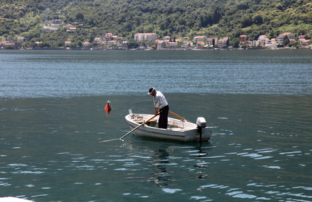 Fishermen in a boat watching their nets, Perast, Montenegro, on June 08, 2012のeditorial素材