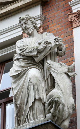 Saint Luke the Evangelist on the facade of Evangelical School in Vienna, Austria on October 10, 2014.のeditorial素材