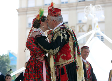 Members of folk group Dubrovacki primorski svatovi from Gornja Sela, Croatia during the 49th International Folklore Festival in center of Zagreb, Croatia on July 17, 2015のeditorial素材