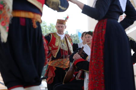 Members of folk group Dubrovacki primorski svatovi from Gornja Sela, Croatia during the 49th International Folklore Festival in center of Zagreb, Croatia on July 17, 2015のeditorial素材