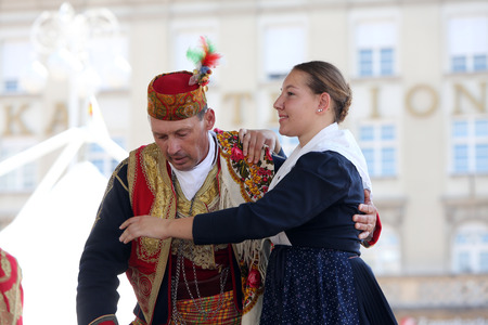 Members of folk group Dubrovacki primorski svatovi from Gornja Sela, Croatia during the 49th International Folklore Festival in center of Zagreb, Croatia on July 17, 2015のeditorial素材