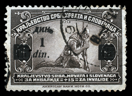 A stamp printed in Kingdom of Serbia, Croatia and Slovenia for the Benefit of Invalid Soldiers, circa 1921.のeditorial素材