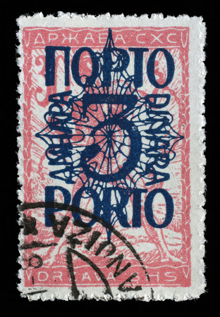A stamp printed in Yugoslavia shows a man breaks the circuit, a symbol of freedom, circa 1919のeditorial素材