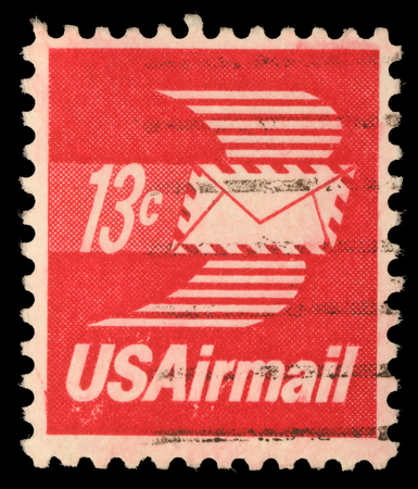 A stamp printed in United States of America shows envelope with wings, Airmail, circa 1973のeditorial素材