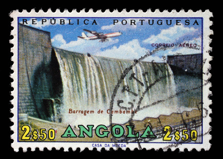 Stamp printed in Angola shows Cambambe Dam, Cambambe Hydroelectric Power Station on Kwanza River, circa 1965のeditorial素材