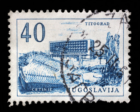 Stamp printed in Yugoslavia, shows Titograd Podgorica Hotel and Open-Air Theater in Cetinje, circa 1958のeditorial素材