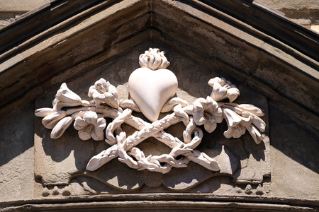 Sacred Heart of Jesus, portal of Saint Catherine church in Lucca, Italyの写真素材