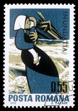 Stamp printed in Romania shows Mother with child and destroyed house, Plight of the Danube flood victims, circa 1970.のeditorial素材