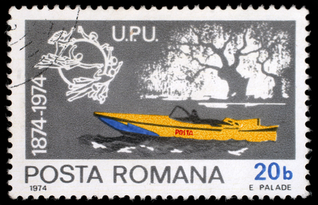Stamp printed in Romania shows Mail motorboat, Centenary of UPU, circa 1974.のeditorial素材