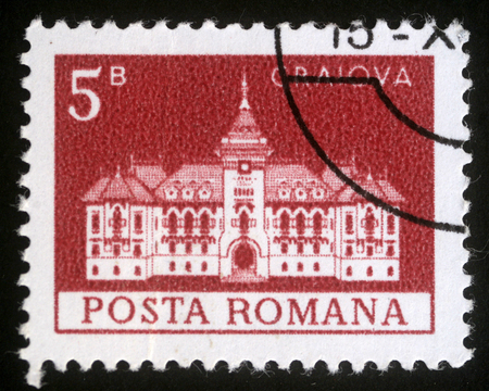 ROMANIA - CIRCA 1973: A stamp printed in Romania shows City Hall, Craiova, circa 1973のeditorial素材