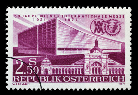 Stamp printed by Austria dedicated to 50 years of the Vienna Fair, shows First and Latest Exhibition Halls, circa 1971のeditorial素材