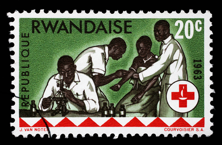 Stamp printed in Rwanda is dedicated to the 100th anniversary of the International Red Cross, circa 1963のeditorial素材