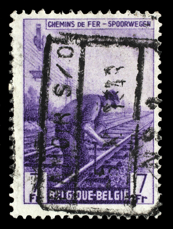 Stamp printed in Belgium shows Railway Worker from The Railway Company at Work issue, circa 1945.のeditorial素材