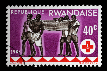 Stamp printed in Rwanda is dedicated to the 100th anniversary of the International Red Cross, circa 1963のeditorial素材