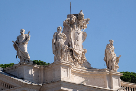 St. Theobald , Theodore , Alexander VII Coat of Arms and St. Jerome, fragment of colonnade of St. Peters Basilica. Papal Basilica of St. Peter in Vatican, Rome, Italyの写真素材